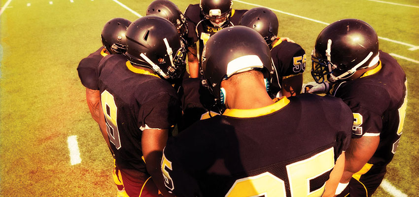 Georgia pastor banned from football field, team keeps praying