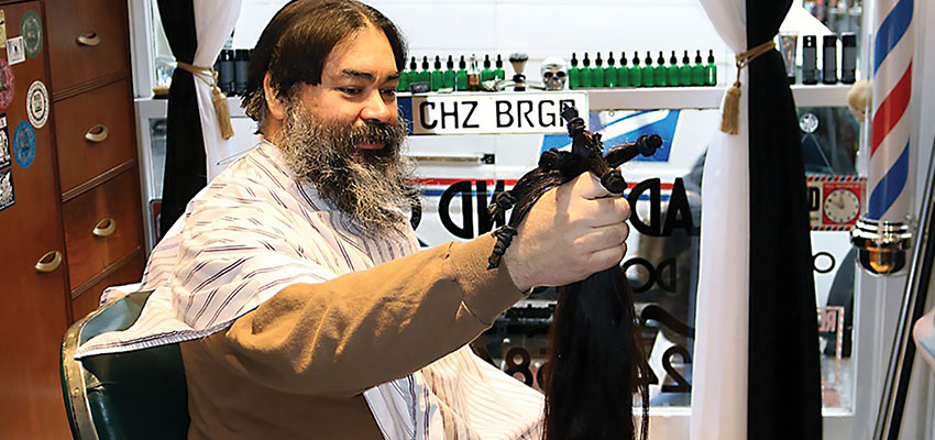 Vet donates 28 inches of hair to cancer victims